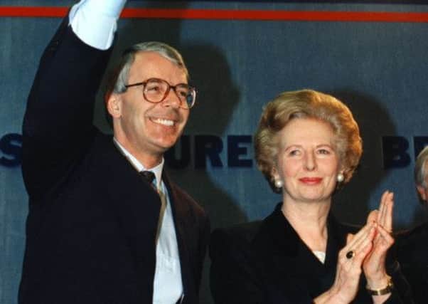 Margaret Thatcher applauds her successor as he celebrates his surprise 1992 election victory. Picture: Getty