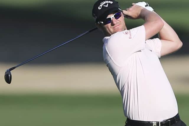 Marc Warren plays a shot on the 10th hole during the round two of the Dubai Desert Classic golf tournament in Dubai. Picture: AP