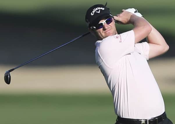 Marc Warren plays a shot on the 10th hole during the round two of the Dubai Desert Classic golf tournament in Dubai. Picture: AP