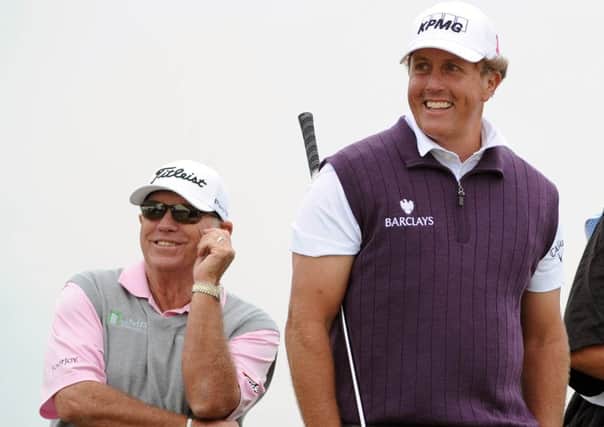 Claude is the son of Butch Harmon, pictured here with Phil Mickelson. Picture: Ian Rutherford