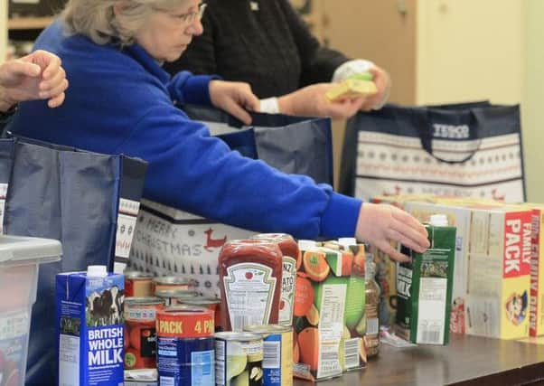 The centre, staffed by around two dozen volunteers, helps more than 1000 people each month with clothes, food and support. Picture: TSPL