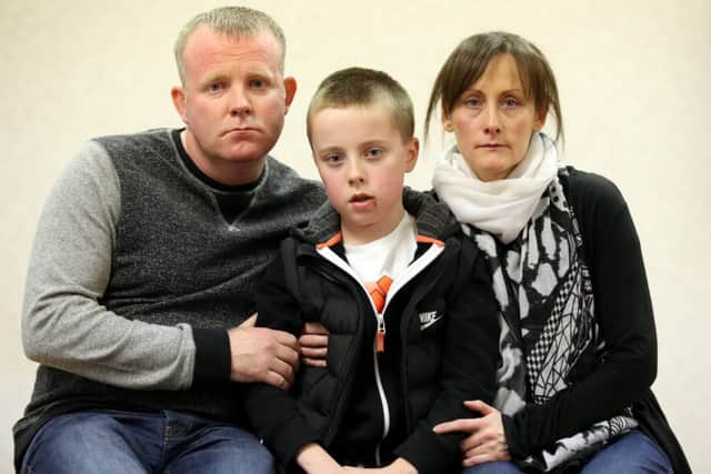 Kieran Duffy with his parents Robert and Amanda. Picture: Hemedia