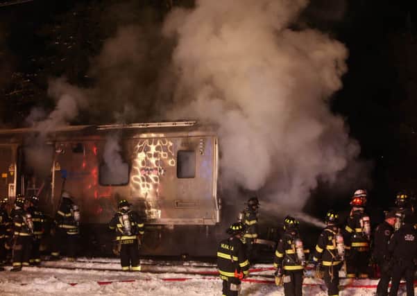 Firefighters work the scene of a collision between a Metro-North Railroad passenger train and a vehicle in Valhalla, N.Y. Picture: AP