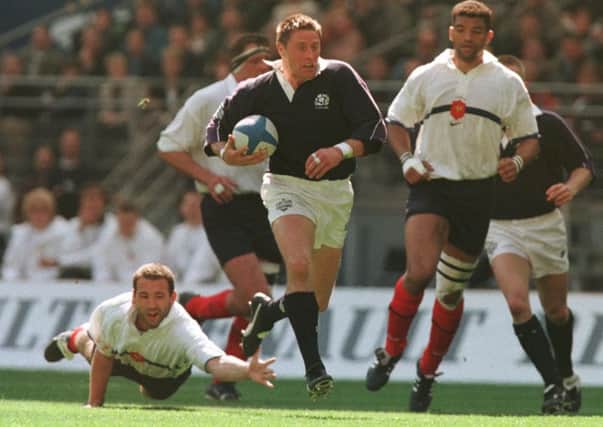 Alan Tait bursts through for his second try in Paris. Picture: Neil Hanna