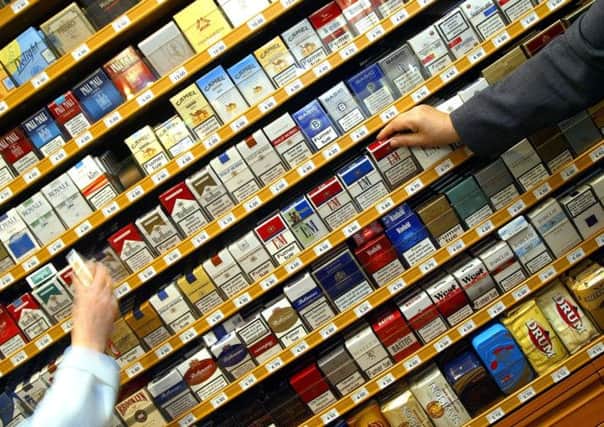 Cigarettes and other tobacco will be out of sight behind small grey doors. Picture: AP