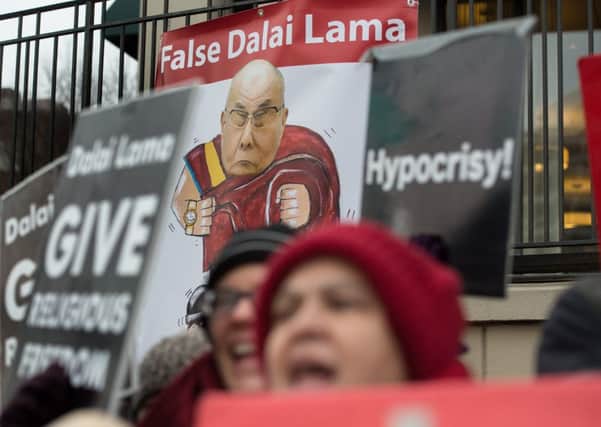 Protesters oppose the Dalai Lama attending the National Prayer Breakfast. Picture: Getty