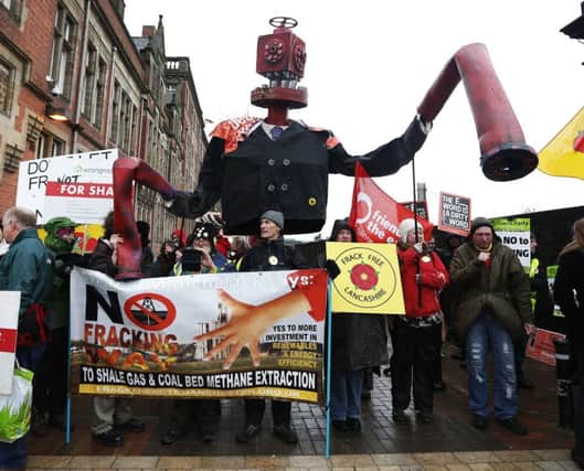 Protesters gather outside Lancashire Council, where a decision was due on two fracking sites. Picture: PA