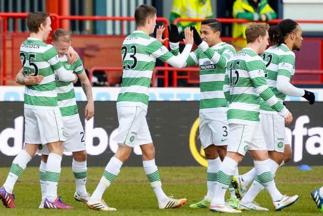 Leigh Griffiths celebrates his goal with his team-mates. Picture: SNS