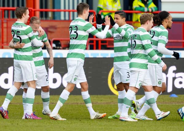 Leigh Griffiths celebrates his goal with his team-mates. Picture: SNS