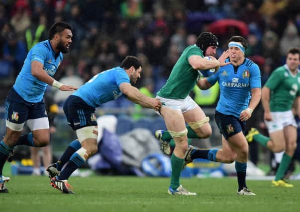 Tommy O'Donnell of Ireland bursts through the Italy defence on his way to scoring his team's second try. Picture: Getty