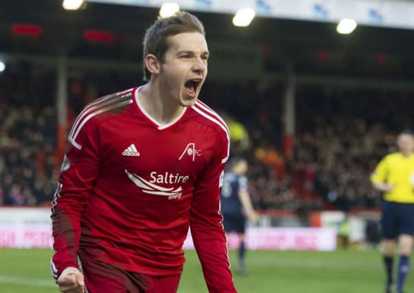 Aberdeen's Peter Pawlett wheels away after putting his side 2-0 up. Picture: SNS Group