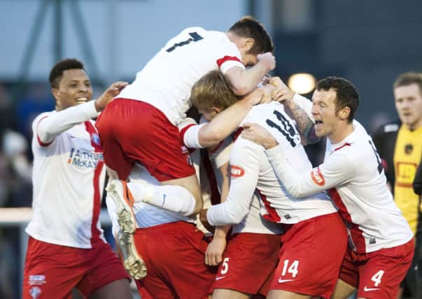 Spartans' Ally MacKinnon is mobbed by his team-mates following the last-gasp equaliser. Picture: SNS