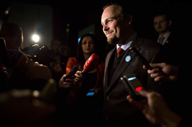 Smiles from Anton Chromik, one of the leaders of the Alliance for Family, after the polls closed. Picture: AFP