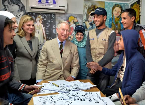 Prince Charles and Justine Greening during the tour of the Al Zaatari refugee camp, Jordan. Picture: PA