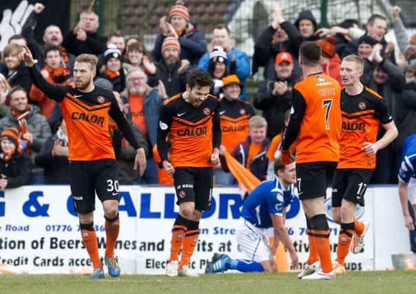 Ryan Dow (centre) celebrates scoring for Dundee Utd. Picture: SNS