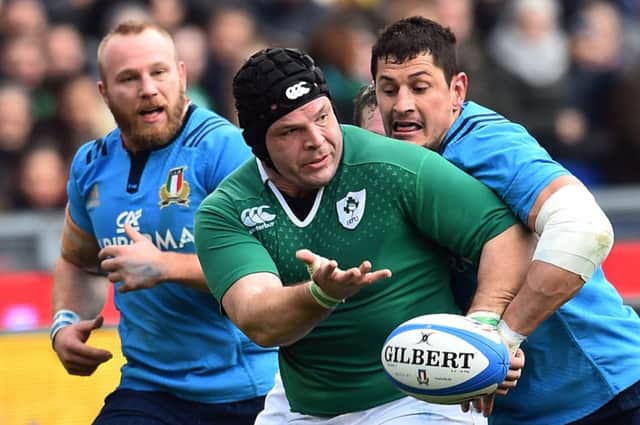 Ireland prop Mike Ross is tackled by Italy flanker Alessandro Zanni at the Stadio Olimpico. Picture: AFP/Getty
