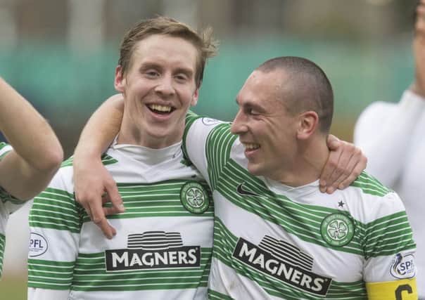 Celtic skipper Scott Brown, right, celebrates with Stefan Johansen. Picture: AP