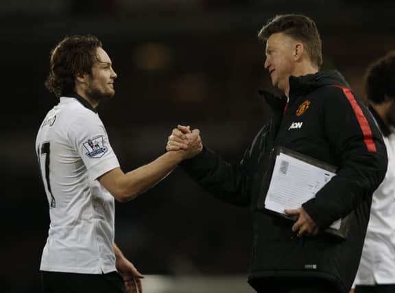 United manager Louis van Gaal congratulates goalscorer Daley Blind after the game. Picture: AFP