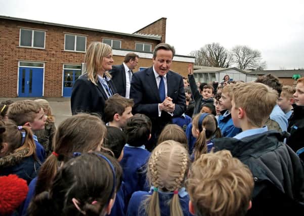 David Cameron went back to school yesterday, telling Chester pupils their classes would get money for redevelopment. Picture: Peter Byrne/PA