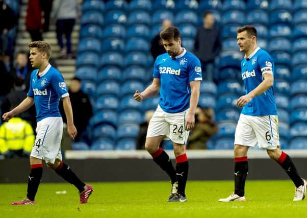 Andrew Murdoch, Darren McGregor and Lee McCulloch troop off the pitch after the Raith Rovers defeat. Picture: SNS