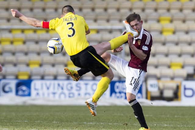 Jason Talbot caught Hearts star Sam Nicholson in the face. Picture: SNS