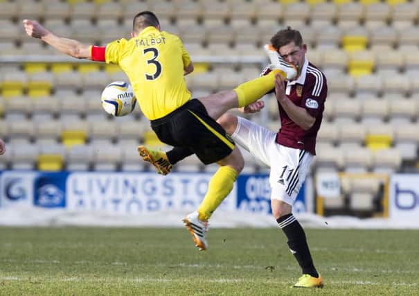 Jason Talbot caught Hearts star Sam Nicholson in the face. Picture: SNS