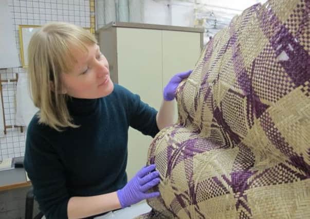 Eve Haddow examines a woven mat from Tongoa island, Vanuatu, alongside other artefacts from the collections of National Museums Scotland, Perth Museum and Art Gallery, Glasgow Museums and Aberdeen University Museums. Picture: Contributed