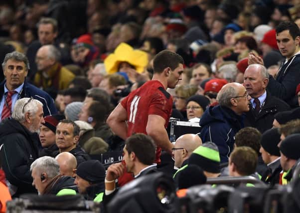 George North leaves the pitch in Cardiff on Friday night to have his head injury assessed. Governing body World Rugby says the Wales wing shouldnt have played on. Picture: PA