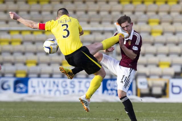 Livingston captain Jason Talbot launches a head-high challenge on Sam Nicholson. Picture: SNS