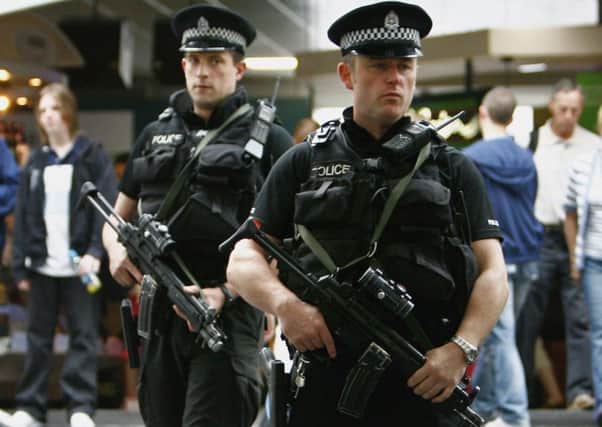 Armed police patrol Glasgow Airport. Picture: Getty