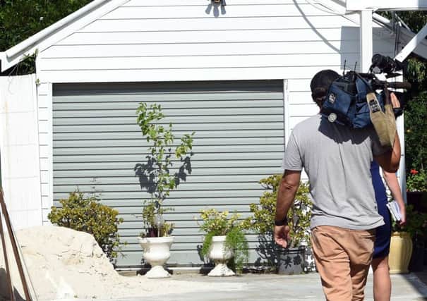 A news cameraman at the scene of the arrests in Fairfield. Picture: Getty