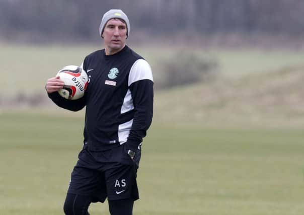 Hibernian manager Alan Stubbs prepares his squad at training. Picture: SNS