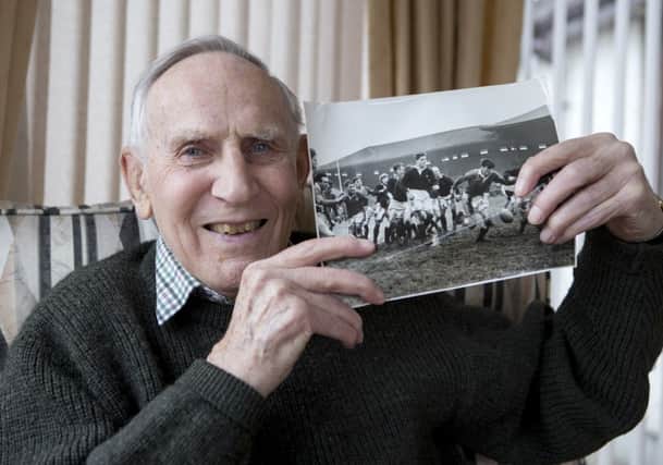 Ernie Michie with a picture of Scotlands win over Wales in 1955. Picture: Ken Macpherson