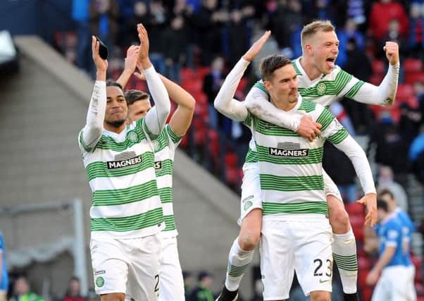 Jason Denayer celebrates with Mikael Lustig and John Guidetti following their win over Rangers. Picture: TSPL
