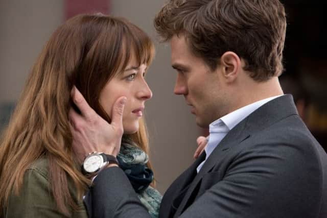 Dakota Johnson and Jamie Dornan in the film version of Fifty Shades of Grey. Picture: PA