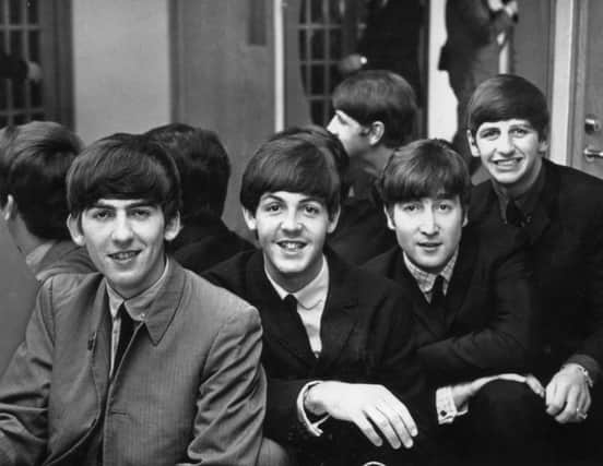 On this day in 1963, the Beatles went to No 1 in the pop charts for the first time with Please Please Me. Picture: Getty