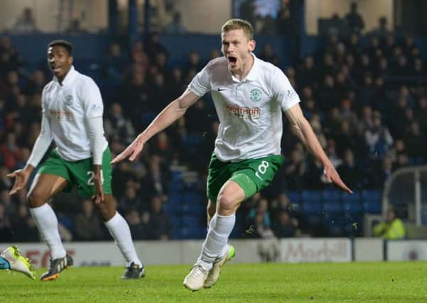 Scott Robertson celebrates opening the scoring for Hibs. Picture: SNS