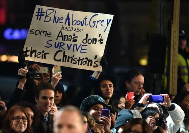 A lone protester holds up a placard as talent arrives for the UK premiere of Fifty Shades of Grey. Picture: Getty