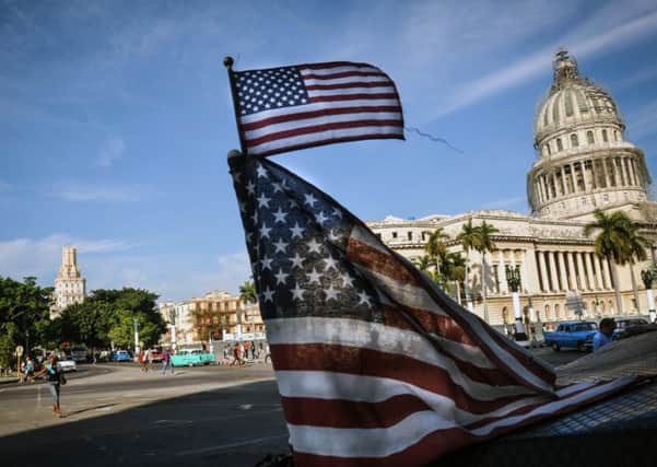 The Stars and Stripes fly on the street opposite the former seat of government, El Capitolio. Photograph: Getty