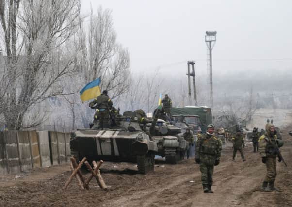 Ukrainian government soldiers park their vehicles near the road between the towns of Dabeltseve and Artemivsk, Ukraine. Picture: AP