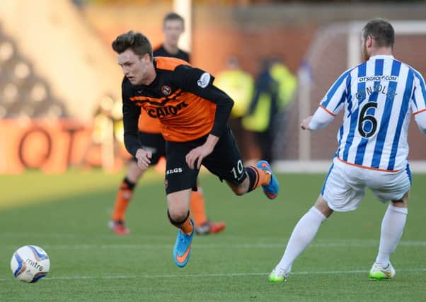 Dundee United's Robbie Muirhead (left) is challenged by Mark Connolly. Picture: SNS Group