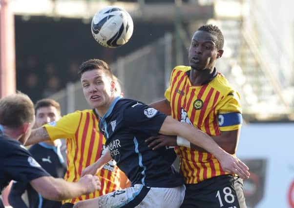 Dundee's Thomas Konrad battles for the ball with Abdul Osman (right). Picture: SNS Group