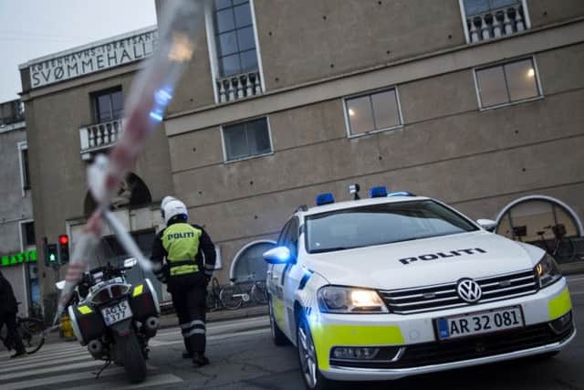 Security officers patrol the perimeter outside the venue in Copenhagen. Picture: AP