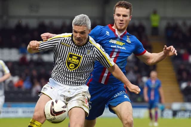 St Mirren's Jim Goodwin, left, holds off Marley Watkins. Picture: SNS