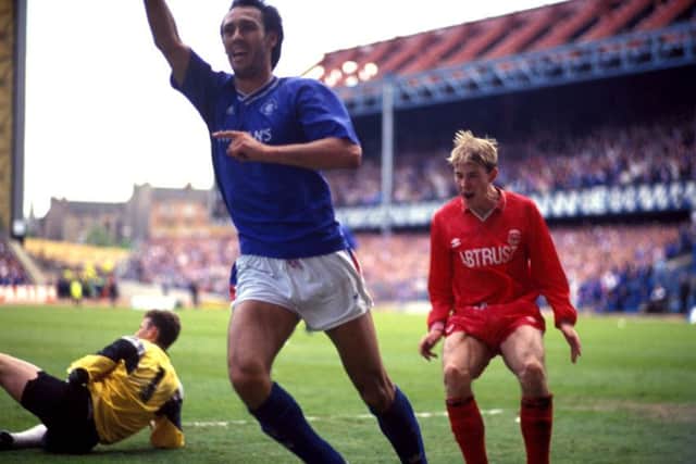 Rangers Mark Hateley ends Aberdeens title dream in 1991 as Dons player Stephen Wright shows his despair. Photograph: SNS