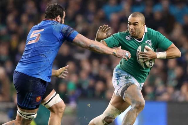 Ireland wing Simon Zebo, right, breaks the tackle of Frances Yoann Maestri during a tense match in Dublin. Photograph: Niall Carson/PA