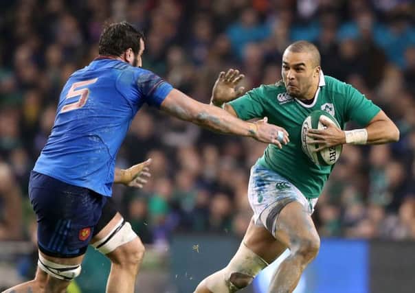Ireland wing Simon Zebo, right, breaks the tackle of Frances Yoann Maestri during a tense match in Dublin. Photograph: Niall Carson/PA