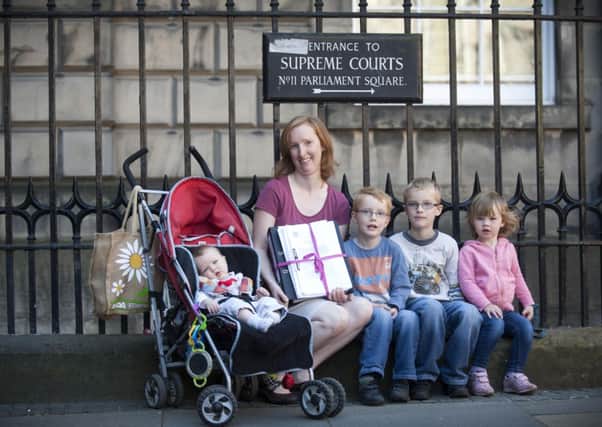 Rhianwen McIntosh, with her children Kaleb, 7, Joel, 4, Charis, 2 and Micah, 7 months, from Bonnybridge, from the No To Named Persons (NO2NP) campaign group. Picture: Jane Barlow