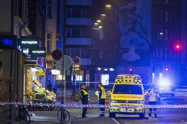 Emergency services close to Norrebro station where the alleged offender was killed. Picture: AFP