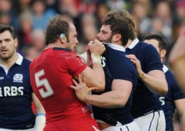 Welsh lock Alun Wyn Jones grabs Scotland hooker Ross Ford by the collar. Picture: Ian Rutherford